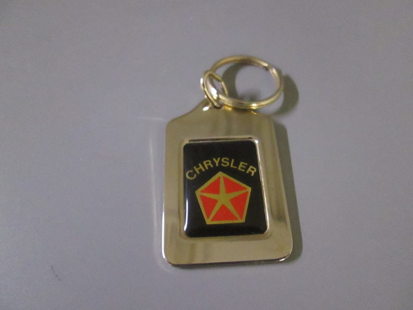 Brass Fob with Red Chrysler Logo