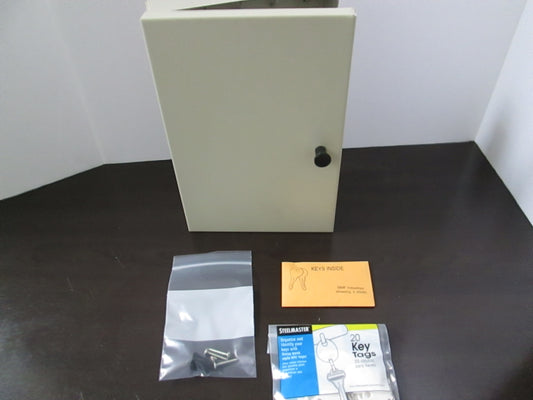 A beige key cabinet with a key lock, accompanied by a key and a packaging that seems to detail the product specifications.